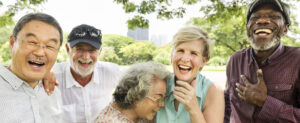 Row of retirees laughing outside